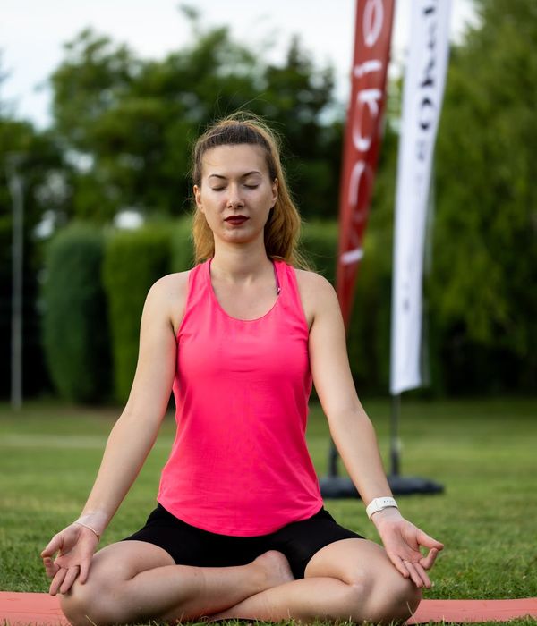 Woman in a calm yoga pose, embodying inner harmony and balance.